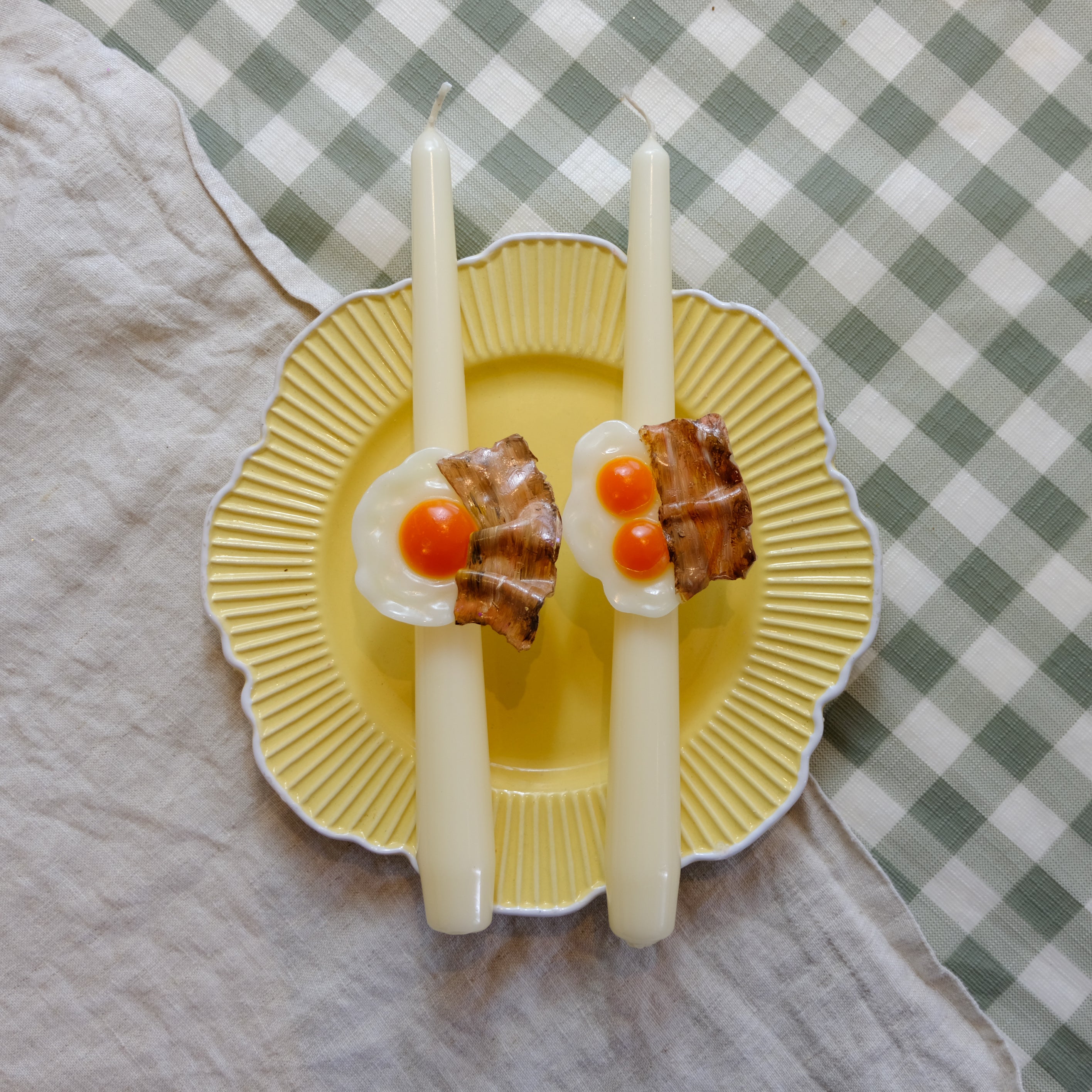 Egg and bacon taper candles for breakfast lovers. Handmade natural wax candle with fried egg charm and crispy bacon detail.